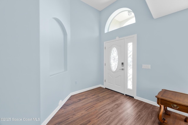 1685 Timacuan Dr, Melbourne, FL 32940 - entrance foyer with wood finished floors, baseboards, and a high ceiling