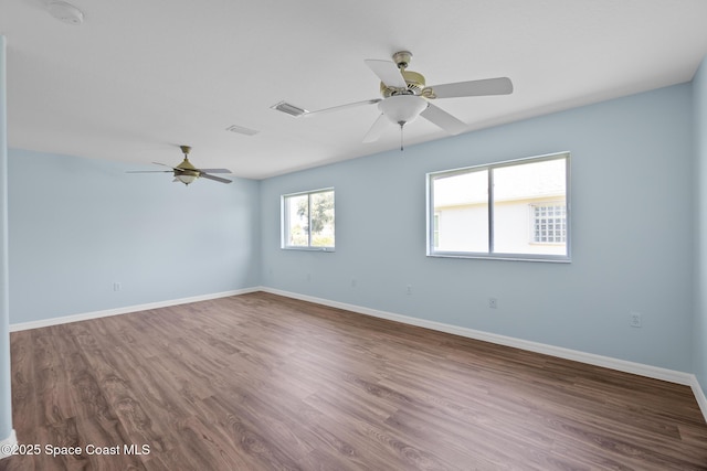 1685 Timacuan Dr, Melbourne, FL 32940 - empty room featuring ceiling fan, wood finished floors, a smoke detector, and baseboards