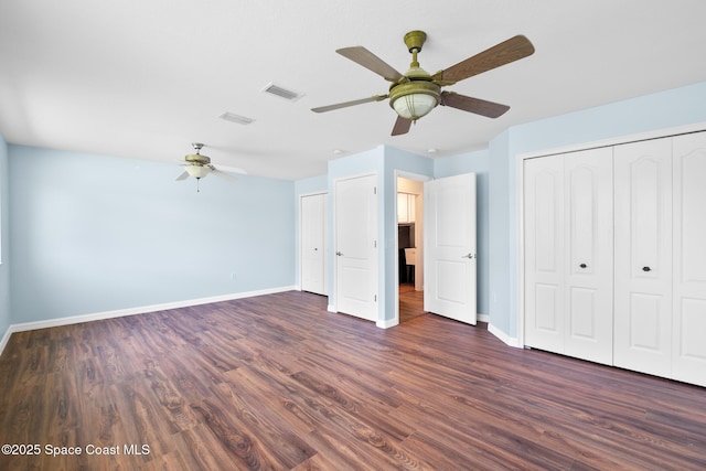 1685 Timacuan Dr, Melbourne, FL 32940 - unfurnished bedroom with baseboards, dark wood-style floors, and ceiling fan