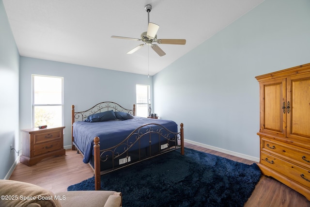 1685 Timacuan Dr, Melbourne, FL 32940 - bedroom with vaulted ceiling, light wood finished floors, baseboards, and a ceiling fan