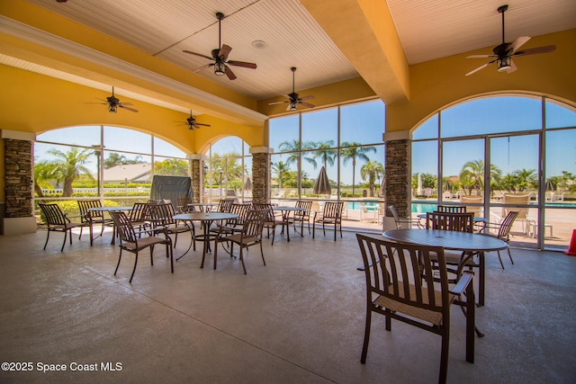 1685 Timacuan Dr, Melbourne, FL 32940 - view of patio / terrace featuring a ceiling fan, an outdoor pool, glass enclosure, and outdoor dining area