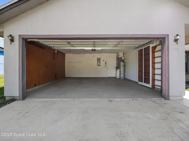175 Awin Cir SE, Palm Bay, FL 32909 - garage featuring electric panel, water heater, and concrete driveway