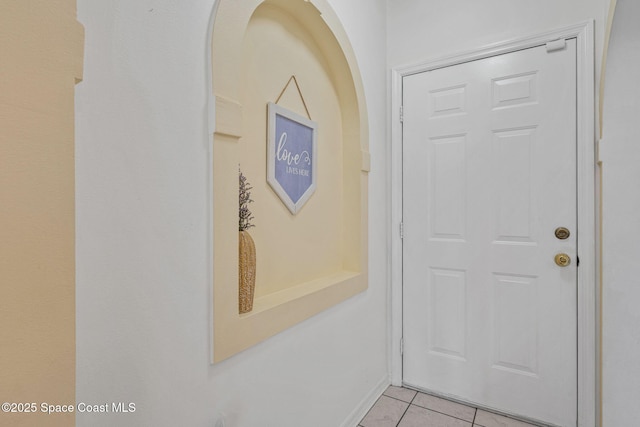 2719 Alicia Ln, Melbourne, FL 32935 - corridor with light tile patterned floors