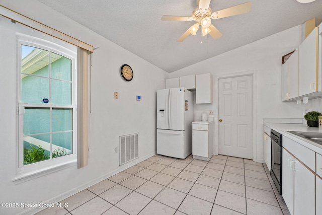 2719 Alicia Ln, Melbourne, FL 32935 - kitchen featuring white fridge with ice dispenser, black dishwasher, white cabinets, lofted ceiling, and light countertops
