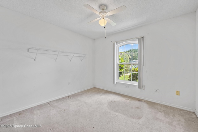 2719 Alicia Ln, Melbourne, FL 32935 - unfurnished room with a textured ceiling, a ceiling fan, baseboards, and carpet