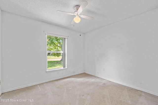 2719 Alicia Ln, Melbourne, FL 32935 - carpeted spare room with a textured ceiling, ceiling fan, and baseboards