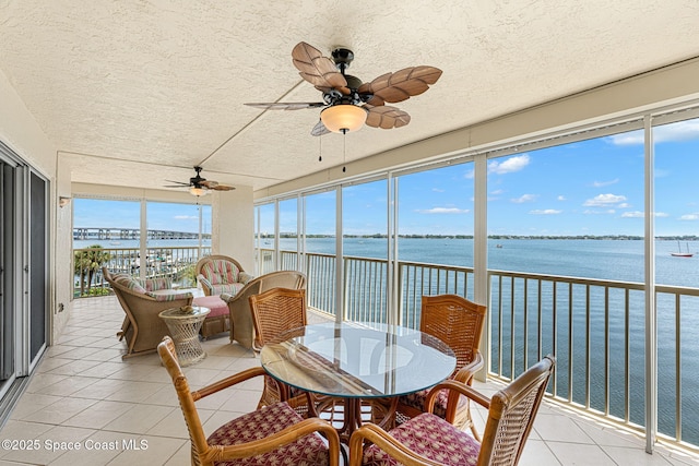 104 Riverside Dr Unit 301, Cocoa, FL 32922 - sunroom / solarium featuring a water view, a textured ceiling, and tile patterned flooring