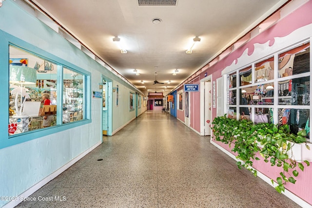 104 Riverside Dr Unit 301, Cocoa, FL 32922 - hallway featuring speckle patterned floor