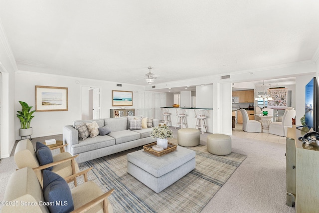 104 Riverside Dr Unit 301, Cocoa, FL 32922 - living room featuring ornamental molding, light colored carpet, ceiling fan, and baseboards
