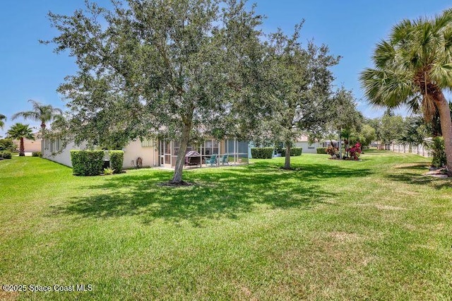 1545 Boca Rio Dr, Melbourne, FL 32940 - view of grassy yard featuring glass enclosure