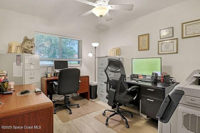 1545 Boca Rio Dr, Melbourne, FL 32940 - home office with light wood finished floors and a ceiling fan