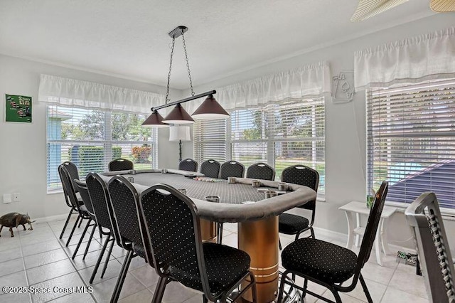 1545 Boca Rio Dr, Melbourne, FL 32940 - dining room featuring light tile patterned floors and baseboards