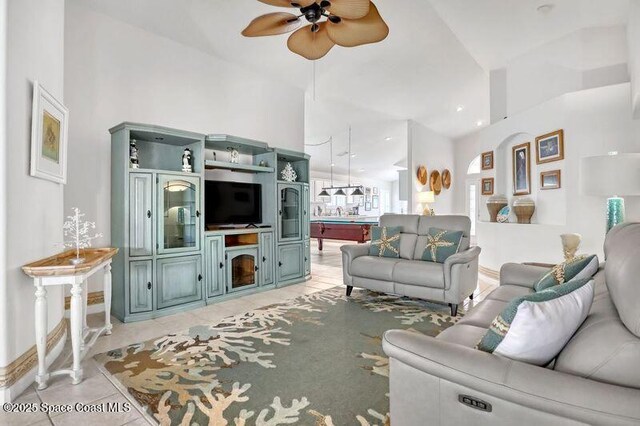 1545 Boca Rio Dr, Melbourne, FL 32940 - living area with a ceiling fan, light tile patterned floors, and baseboards
