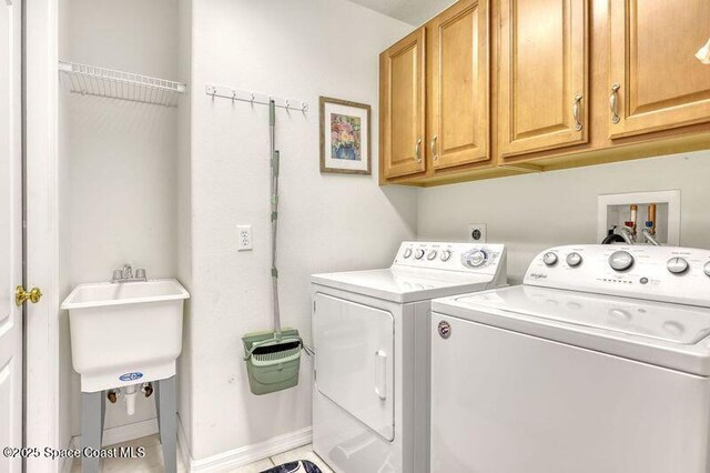 1545 Boca Rio Dr, Melbourne, FL 32940 - laundry area featuring cabinet space, independent washer and dryer, and baseboards