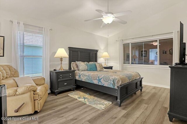 1545 Boca Rio Dr, Melbourne, FL 32940 - bedroom featuring light wood-type flooring, vaulted ceiling, ceiling fan, and baseboards