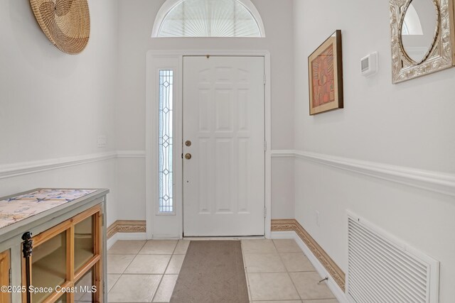 1545 Boca Rio Dr, Melbourne, FL 32940 - entrance foyer with light tile patterned floors and baseboards