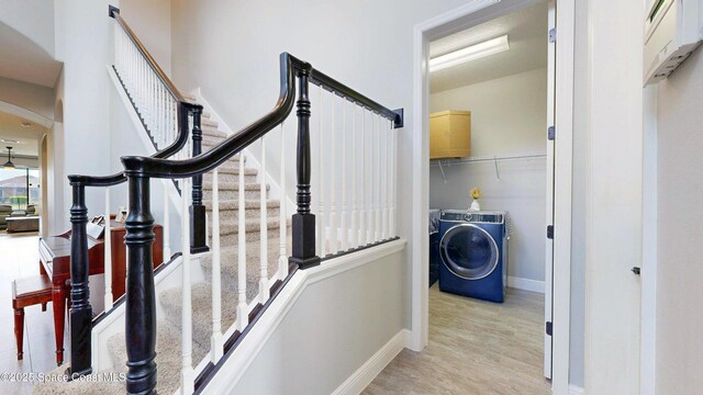 8051 Strom Park Dr, Melbourne, FL 32940 - stairway with arched walkways, wood finished floors, and baseboards