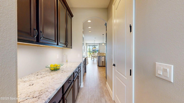 8051 Strom Park Dr, Melbourne, FL 32940 - hall featuring arched walkways, light wood-type flooring, and recessed lighting
