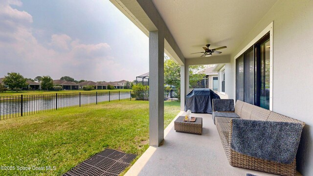 8051 Strom Park Dr, Melbourne, FL 32940 - view of yard with a water view, a ceiling fan, outdoor lounge area, a patio area, and a residential view