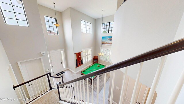 8051 Strom Park Dr, Melbourne, FL 32940 - stairs with a towering ceiling and baseboards
