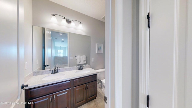 8051 Strom Park Dr, Melbourne, FL 32940 - bathroom with double vanity and toilet