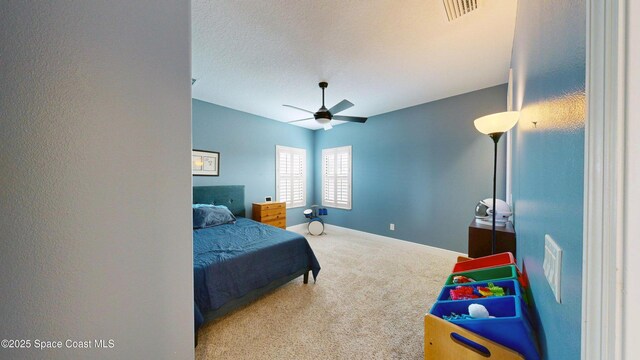 8051 Strom Park Dr, Melbourne, FL 32940 - carpeted bedroom featuring baseboards, a ceiling fan, and a textured ceiling