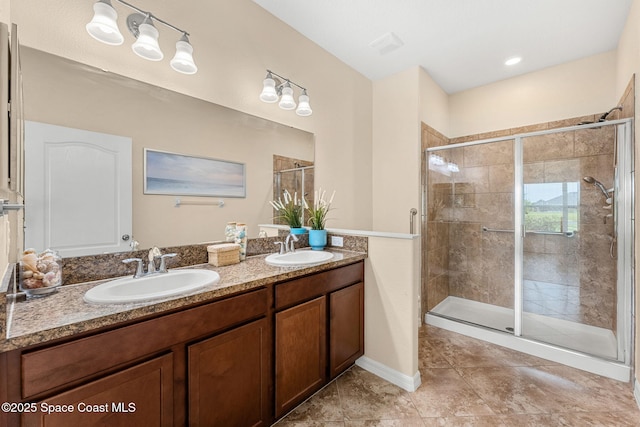 5928 Van Ness Dr, Melbourne, FL 32940 - full bath with a stall shower, double vanity, and tile patterned flooring