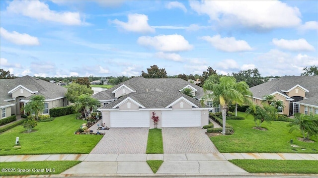 4160 Aberdeen Cir, Rockledge, FL 32955 - view of front of home featuring a residential view, driveway, a front yard, and stucco siding