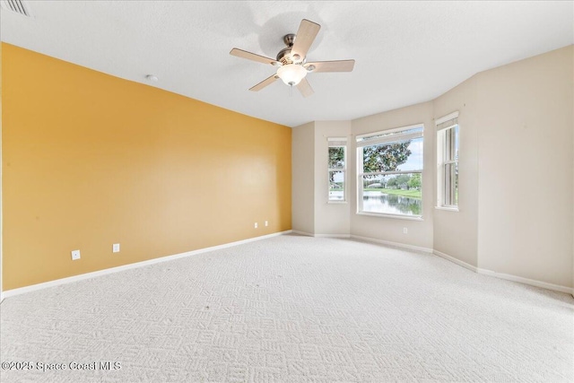 4160 Aberdeen Cir, Rockledge, FL 32955 - spare room with a ceiling fan and light carpet