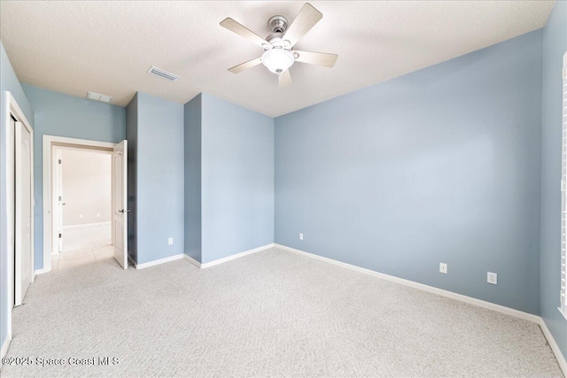 4160 Aberdeen Cir, Rockledge, FL 32955 - spare room featuring a ceiling fan, light carpet, and a textured ceiling