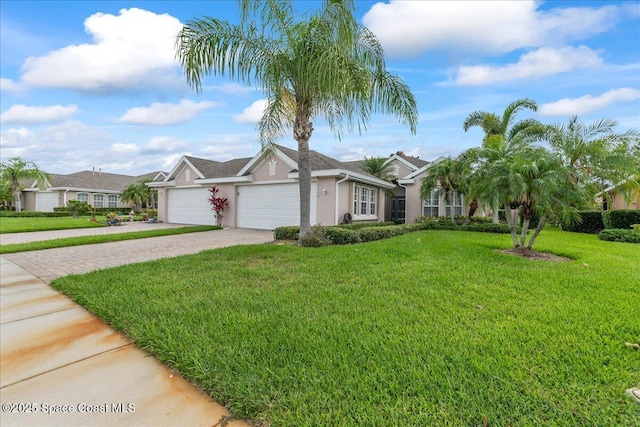 4160 Aberdeen Cir, Rockledge, FL 32955 - ranch-style house with an attached garage, decorative driveway, stucco siding, and a front yard