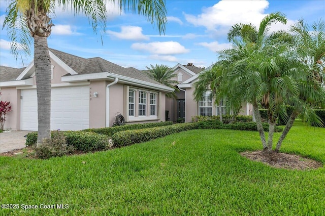 4160 Aberdeen Cir, Rockledge, FL 32955 - ranch-style house with stucco siding, a garage, a front lawn, driveway, and a shingled roof