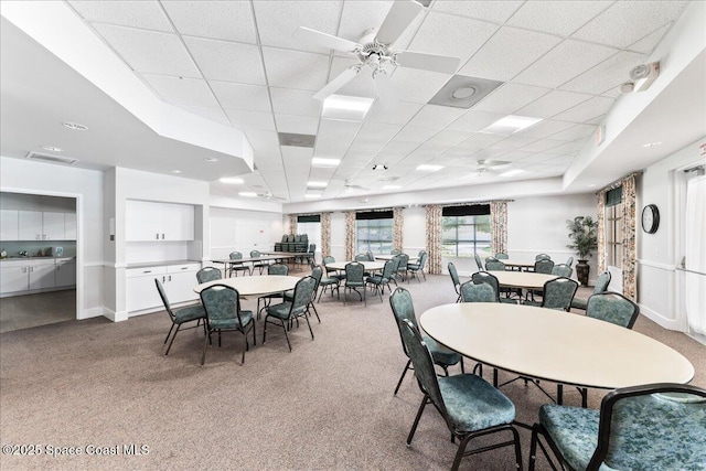 4160 Aberdeen Cir, Rockledge, FL 32955 - carpeted dining area featuring a ceiling fan and a paneled ceiling