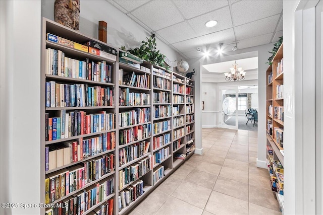 4160 Aberdeen Cir, Rockledge, FL 32955 - hall with a drop ceiling, tile patterned floors, and a chandelier