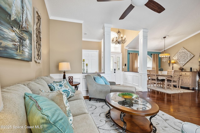3360 Fort Sumter St, Melbourne, FL 32934 - living area with ceiling fan, wood finished floors, crown molding, decorative columns, and a chandelier