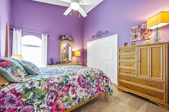 3360 Fort Sumter St, Melbourne, FL 32934 - carpeted bedroom with high vaulted ceiling, a closet, and a ceiling fan