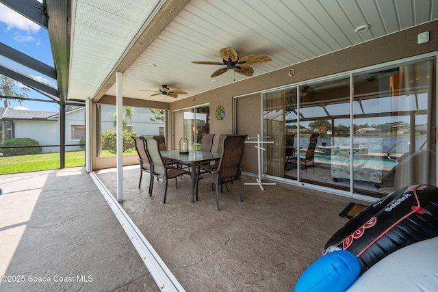 3360 Fort Sumter St, Melbourne, FL 32934 - sunroom with ceiling fan and outdoor dining space