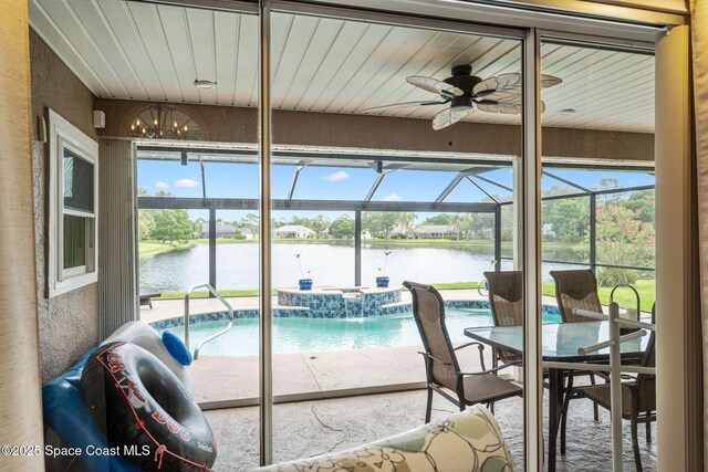 3360 Fort Sumter St, Melbourne, FL 32934 - sunroom featuring ceiling fan, a water view, a jacuzzi, a swimming pool, and a chandelier