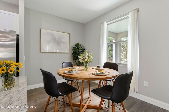 1342 Tordira St SE, Palm Bay, FL 32909 - dining space featuring dark wood-style floors and baseboards