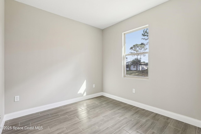 1342 Tordira St SE, Palm Bay, FL 32909 - unfurnished room featuring wood tiled floors and baseboards