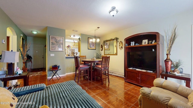 824 Temple St, Cocoa, FL 32922 - living area featuring arched walkways and a chandelier