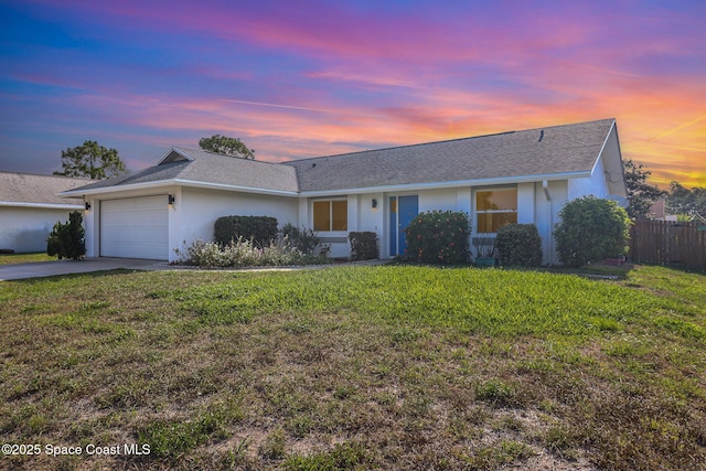 1573 Eagle Ave NW, Palm Bay, FL 32907 - single story home featuring a garage, driveway, stucco siding, and a shingled roof