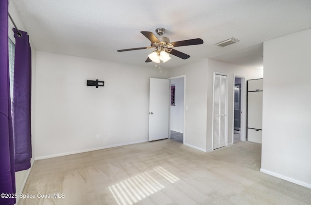 1573 Eagle Ave NW, Palm Bay, FL 32907 - carpeted empty room featuring ceiling fan and baseboards