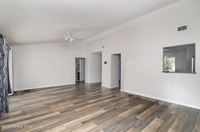 1573 Eagle Ave NW, Palm Bay, FL 32907 - unfurnished room featuring ceiling fan, a textured ceiling, wood finished floors, baseboards, and high vaulted ceiling