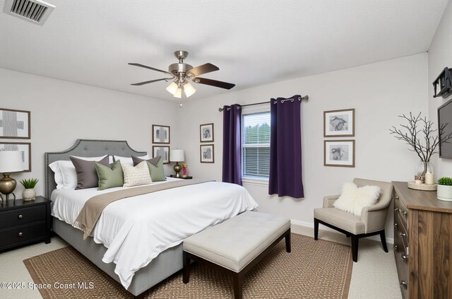 1573 Eagle Ave NW, Palm Bay, FL 32907 - bedroom with light carpet, baseboards, and ceiling fan