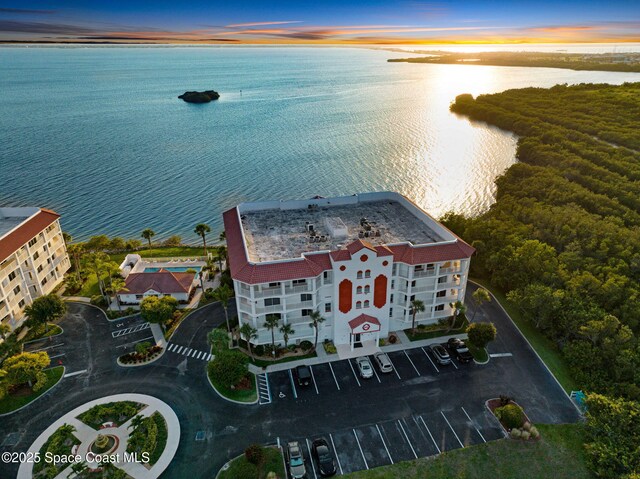 8984 Puerto Del Rio Dr Unit 202, Cape Canaveral, FL 32920 - aerial view at dusk of a water view