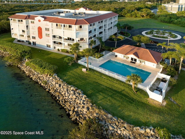 8984 Puerto Del Rio Dr Unit 202, Cape Canaveral, FL 32920 - aerial view of property and surrounding area featuring a pool area and a nearby body of water