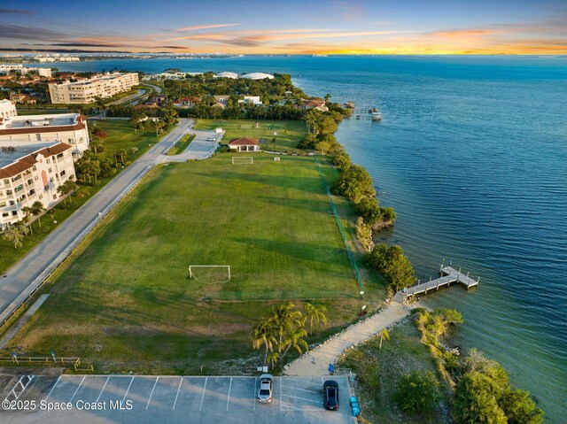 8984 Puerto Del Rio Dr Unit 202, Cape Canaveral, FL 32920 - aerial view at dusk of a water view