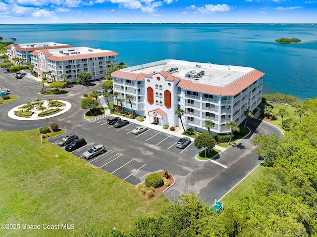 8984 Puerto Del Rio Dr Unit 202, Cape Canaveral, FL 32920 - aerial view of apartment complex and a nearby body of water
