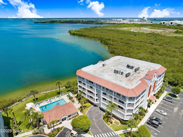 8984 Puerto Del Rio Dr Unit 202, Cape Canaveral, FL 32920 - drone / aerial view of a nearby body of water and a pool area